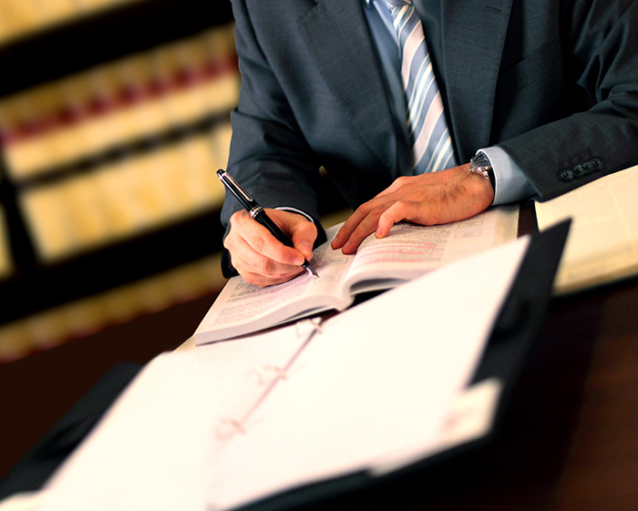 Attorney at desk doing research.