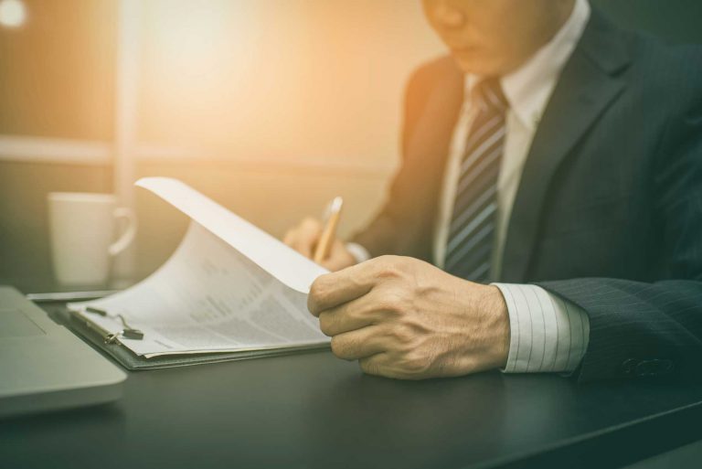 Businessman signing a contract.